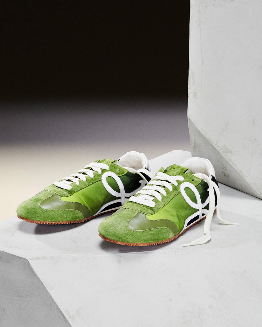 LOEWE - The Ballet Runner arrives in new colourways.

A lightweight sneaker with supple sole and elasticated sides combining the construction of a ballet pump with the style of a 1970s track shoe.

Av...