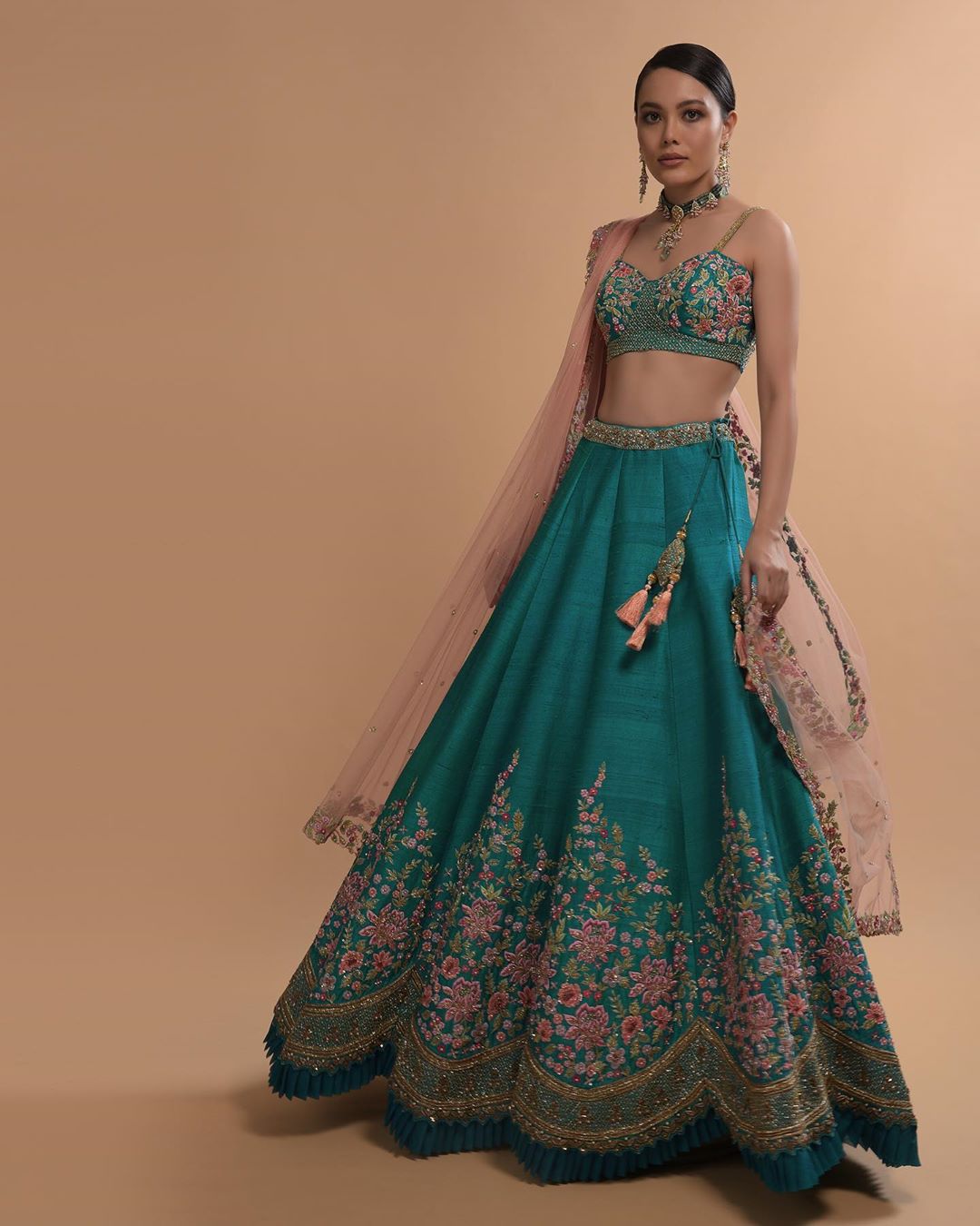 KALKI Fashion - #kalkixkesa🧚🏻
#TealWatersSeries
Adorned with resham, cut dana, zardozi and pearls embroidered in spring blooms, the teal blue lehenga specializes in cut-work hem as a unique element. W...