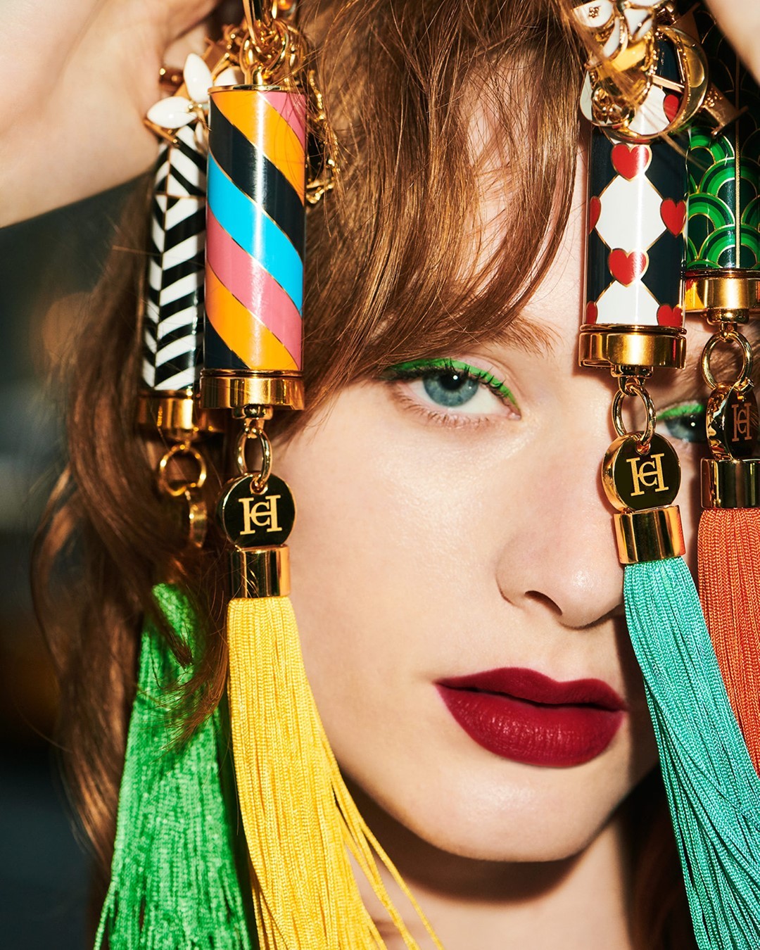 CAROLINA HERRERA - The #HerreraBeauty lipsticks: Are you obsessed yet? You will be once you see our selection of accessories. Customize yours with one of 10 rainbow-hued tassels and signature charms i...