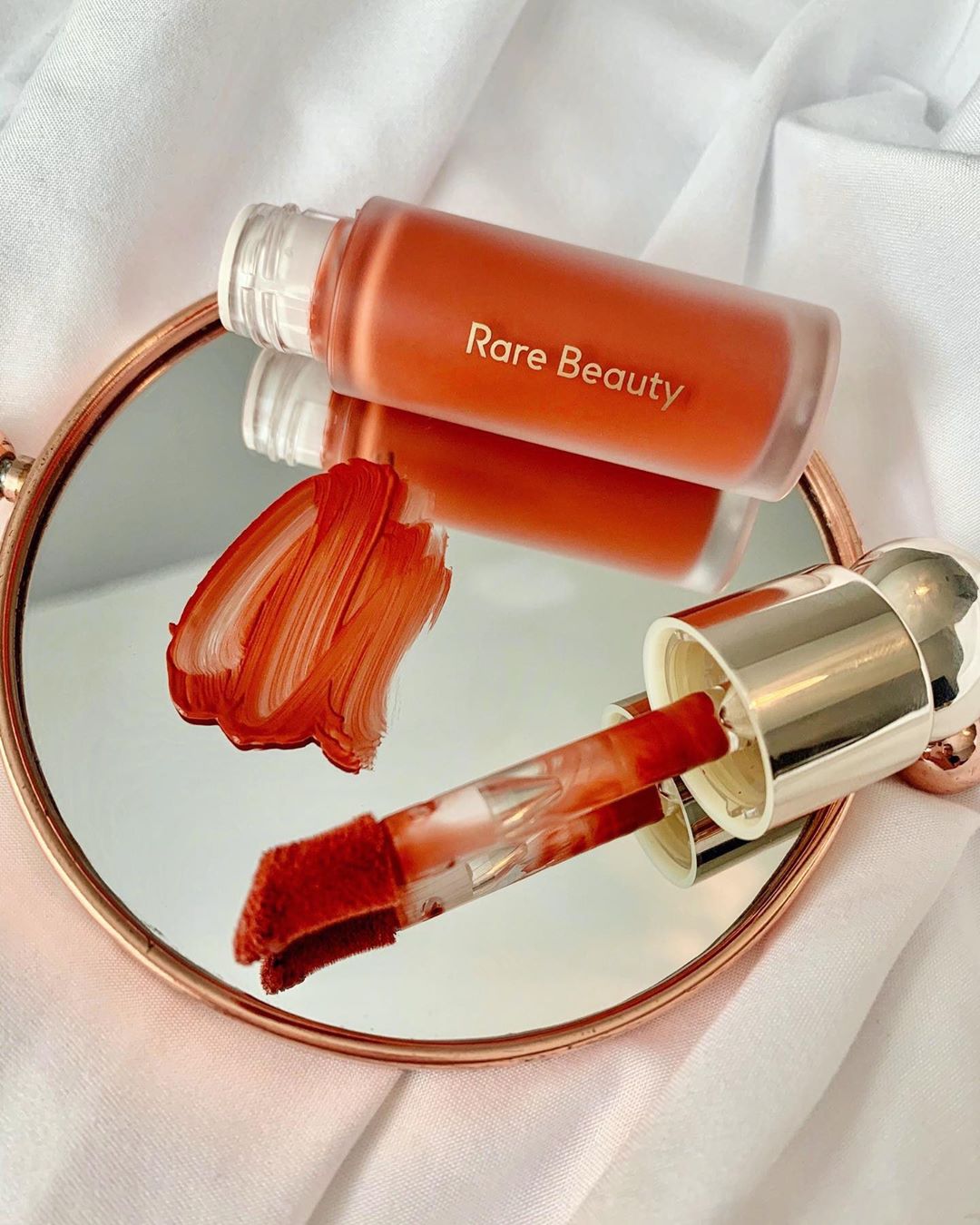 Rare Beauty by Selena Gomez - Spotted 👀 : Our go-to blush for that fresh autumn flush. 🍂 ❤️ Using the doe-foot applicator, apply 1-2 dots of Soft Pinch Liquid Blush in Love—a gorgeous matte terracotta...