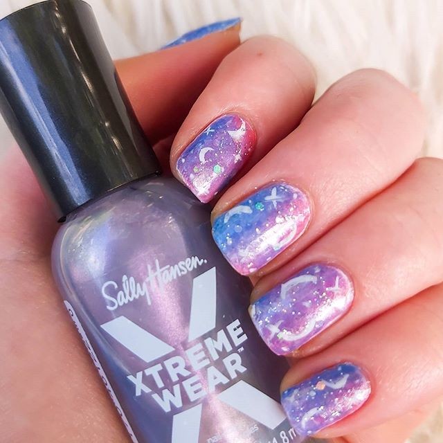 Sally Hansen - @nailartbyamelia’s Celestial mani is out of this world 🌌 Drop a 🧡 if you agree!