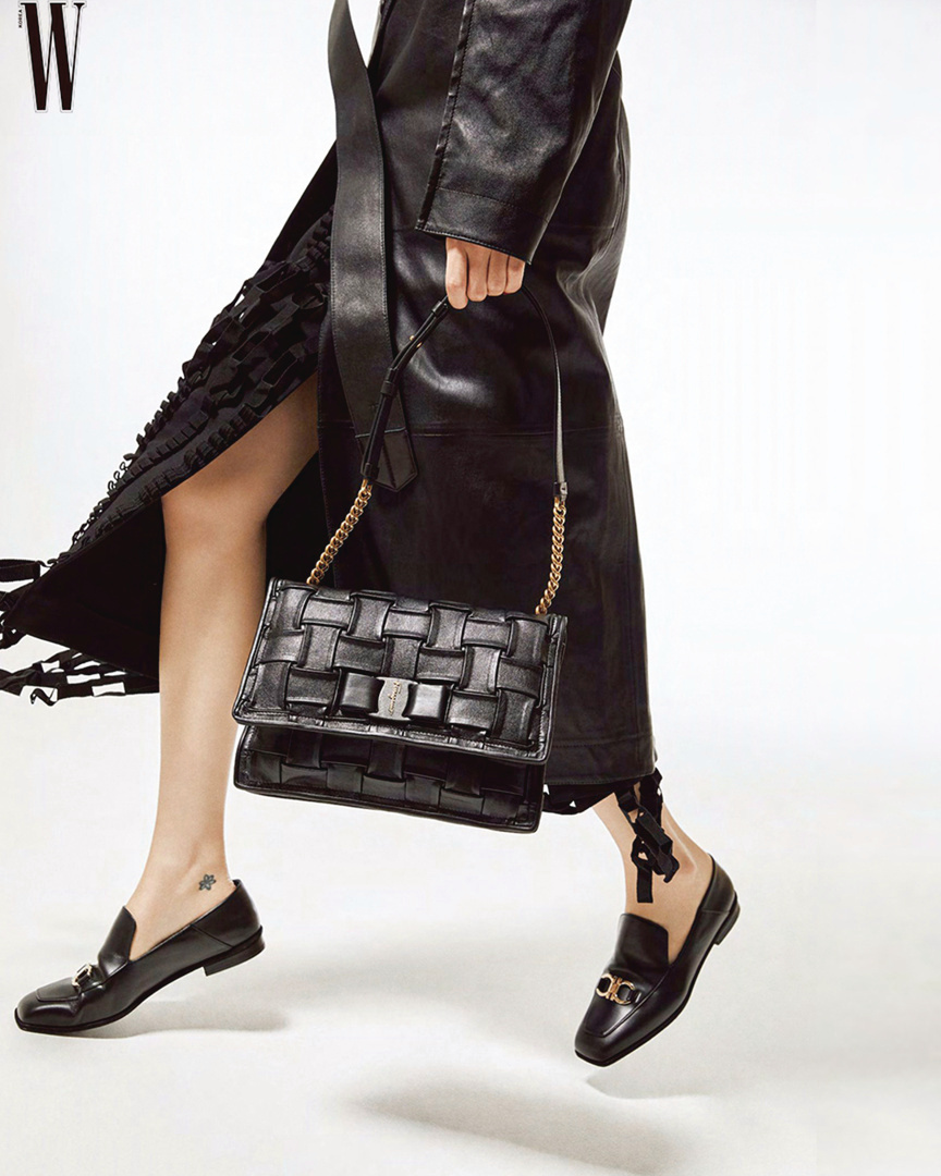 Salvatore Ferragamo - Striding into a big autumn mood on the pages of @wkorea, stylishly equipped with an artisanal woven Viva Bow Bag and nappa leather trench look from the #FerragamoAW runway.