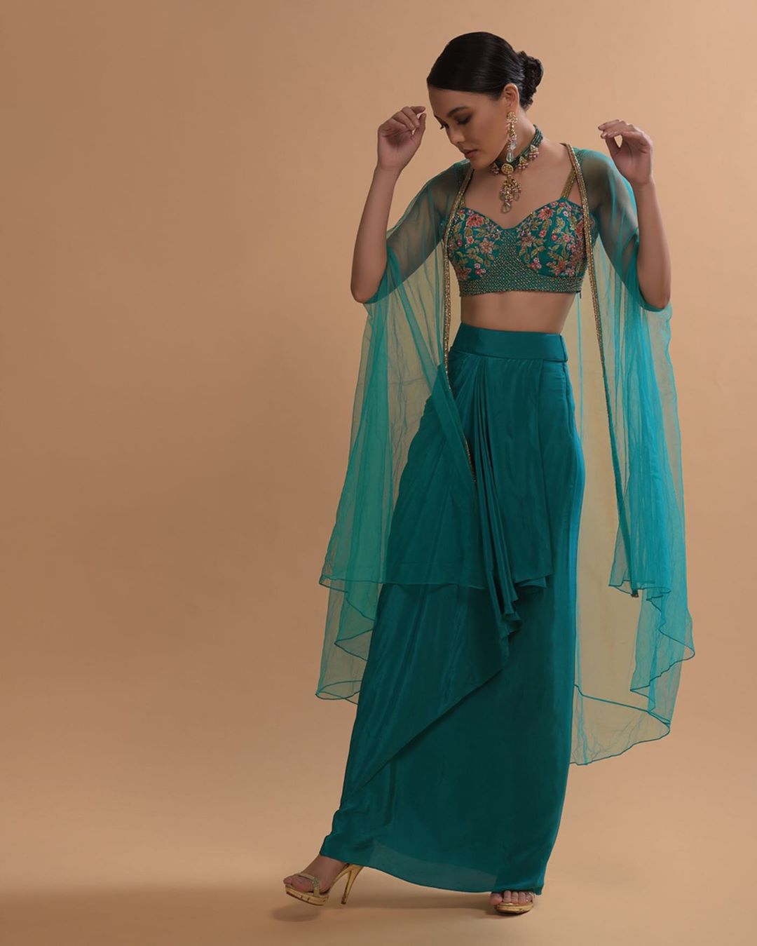 KALKI Fashion - #kalkixkesa🧚🏻
#TealWatersSeries
Painstaking autumn sequins and hand-done French-knots on luxe silks in an opulent hue in deep water renders this fancy draped skirt style as extraordina...