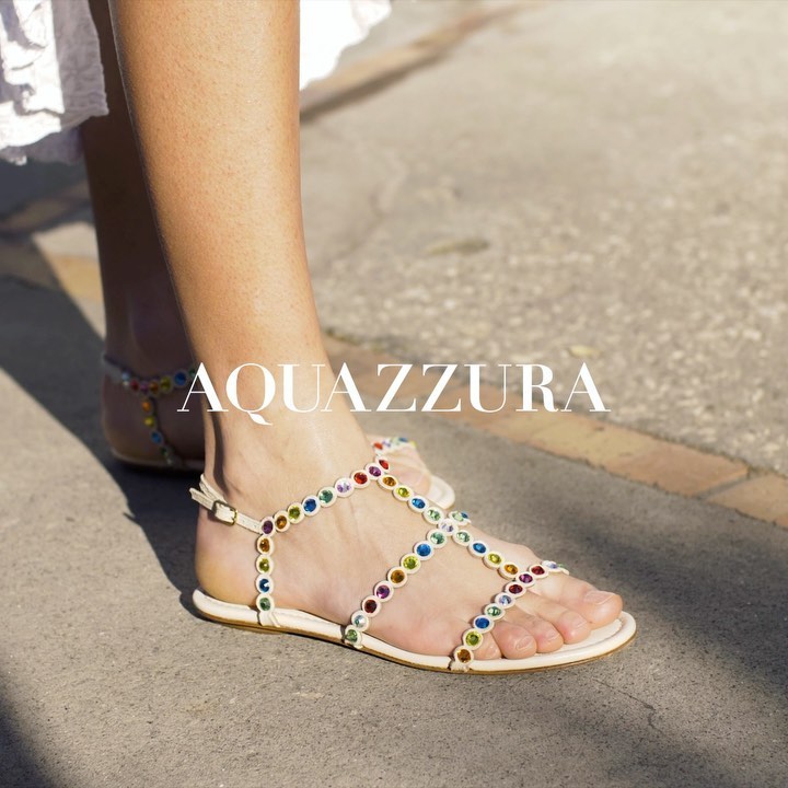 AQUAZZURA - Walking around the picturesque landscape of Capri wearing our Tequila Sandals, crafted in supple cream nappa leather embellished with gleaming rainbow-hued gems. Available on www.aquazzura...