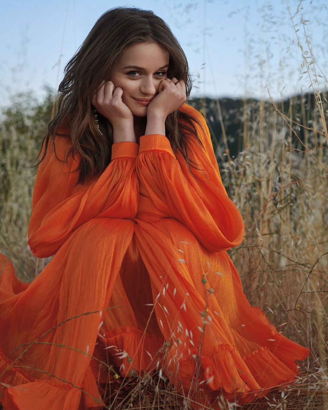 CAROLINA HERRERA - Step boldly into the new season with this clementine orange cape mini dress from the #fall2020 collection, cut from crinkled silk with a gathered hem. As worn by @joeyking for the S...