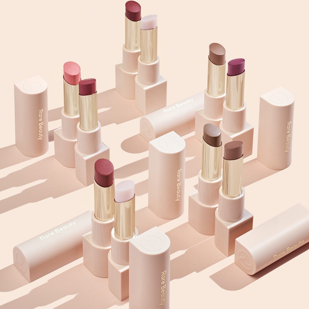 Rare Beauty by Selena Gomez - Add a kiss 😘 of sheer, buildable color. Weightless yet conditioning, With Gratitude Dewy Lip Balm nurtures and nourishes lips without feeling sticky or greasy. If you're...