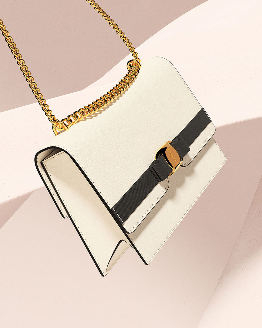Salvatore Ferragamo - Distilled elegance in classic proportions. A new interpretation of the iconic Vara bow emerges with the impossibly sophisticated Vara Bow Bag, equipped with a front flap and a go...