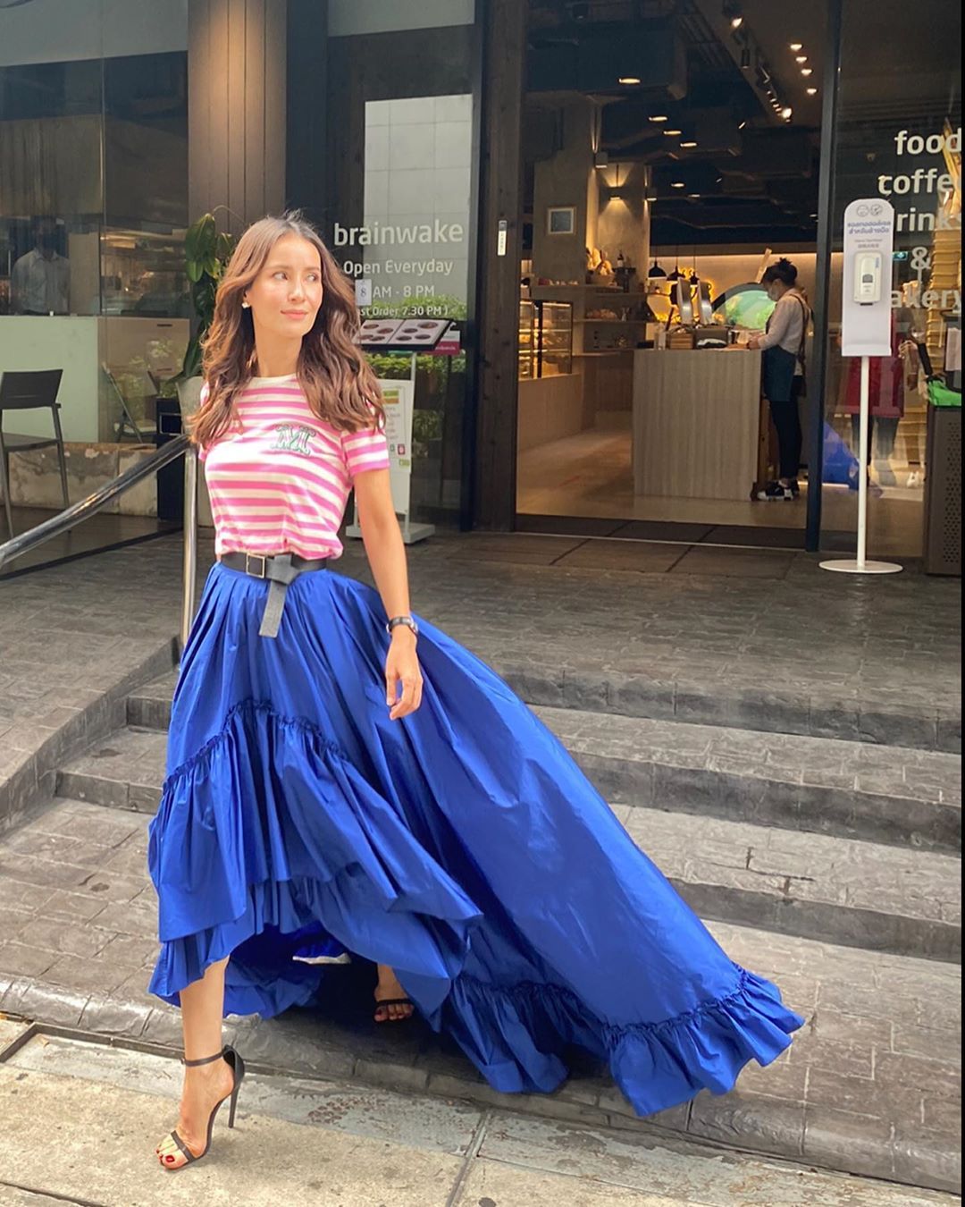Max Mara - Actress @annethong wears the #MaxMaraPreFall20 total look featuring the striped fuchsia t-shirt combined with the asymmetrical taffeta skirt in cobalt blue.