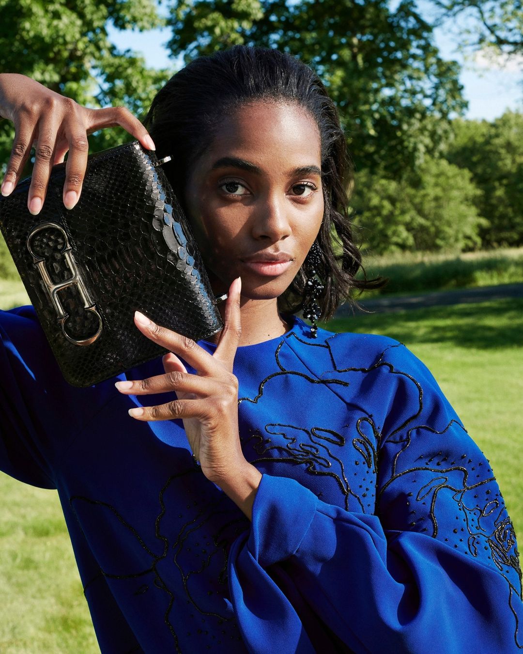 CAROLINA HERRERA - Strike a pose in this season’s blue florals and a stunning #CHInitialsInsignia bag. Shot by @paul_maffi at the Connecticut country home of Creative Director @wesgordon.
#CHInsignia