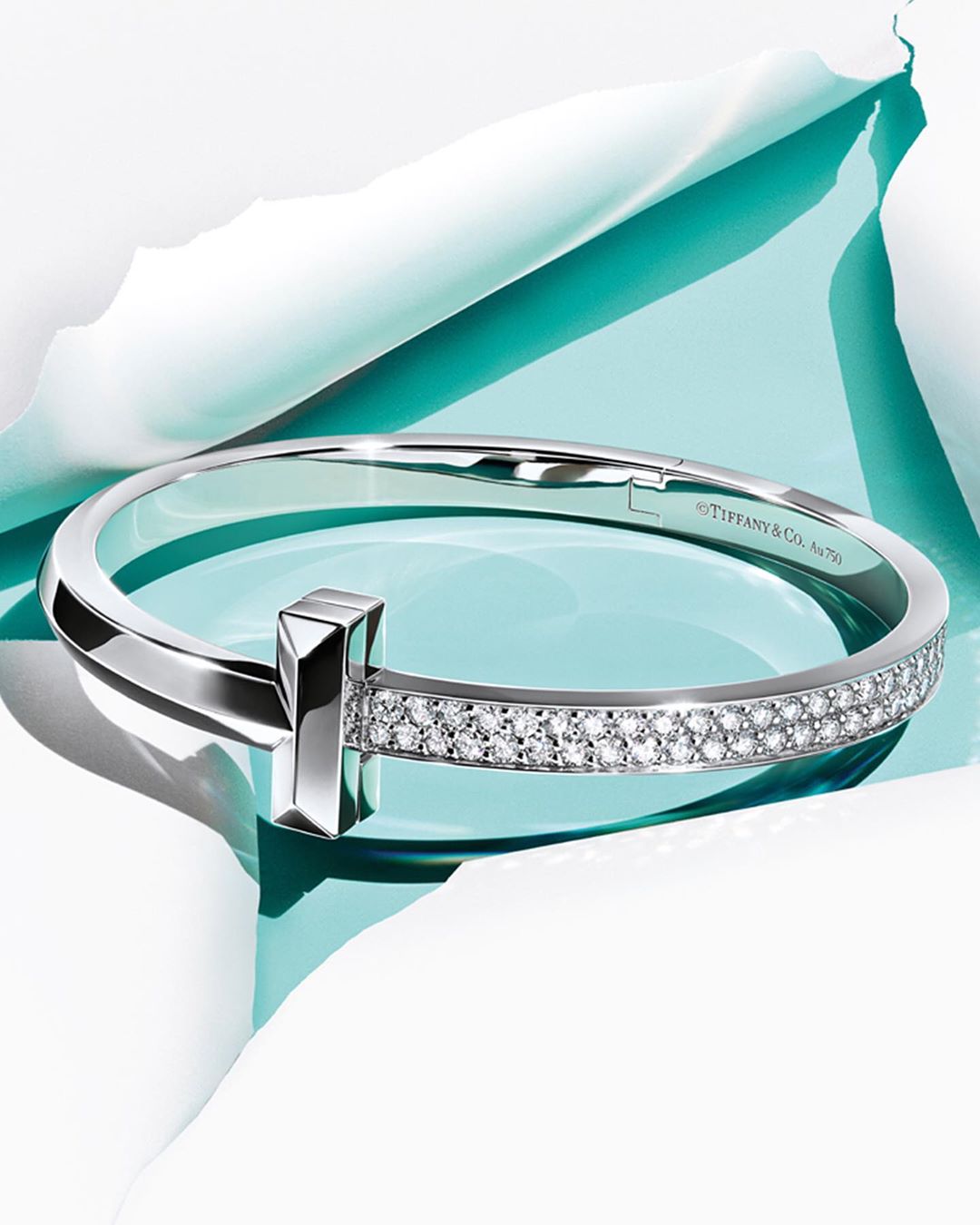 Tiffany & Co. - Tiffany T1—the ultimate icon. Now in 18k white gold, each diamond was set by hand in an intricate honeycomb pattern for added dimension and shine. Tap for extra ice and discover more v...