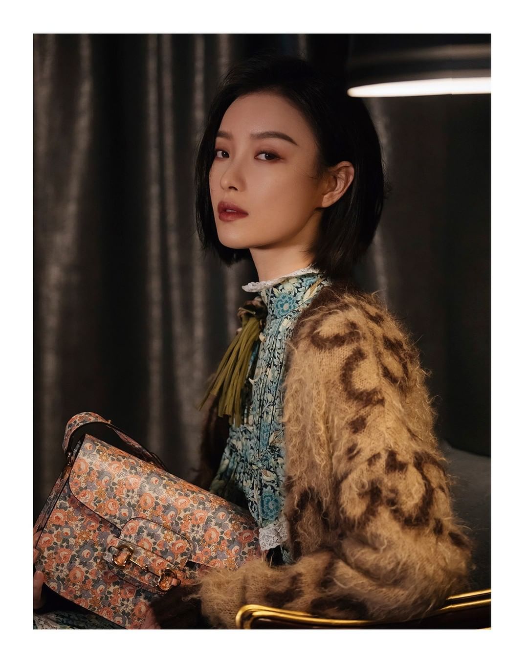 Gucci Official - #NiNi @captainmiao is captured wearing a #GucciFW20 GG jacquard reversible wool cardigan over a crêpe maxi dress and #GucciHorsebit1955 shoulder bag—both special #GucciLiberty pieces...