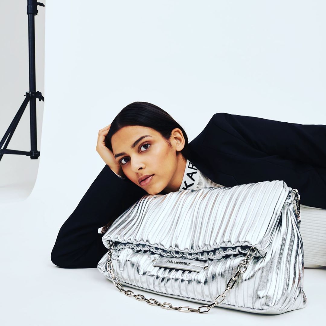 KARL LAGERFELD - With its unique pleated finish, the K/Kushion is padded in appearance and pillowy soft to touch. Tap to shop the style in stunning metallic silver. #KARLLAGERFELD #BAG