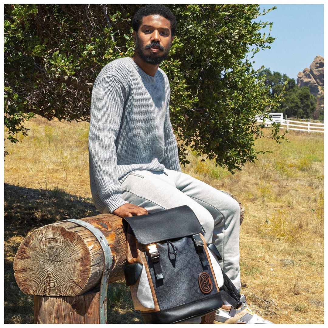 Coach - Press pause. #MichaelBJordan keeps it cool for fall in steely neutrals and our always-in-season Rivington backpack. #CoachxMBJ #CoachNY