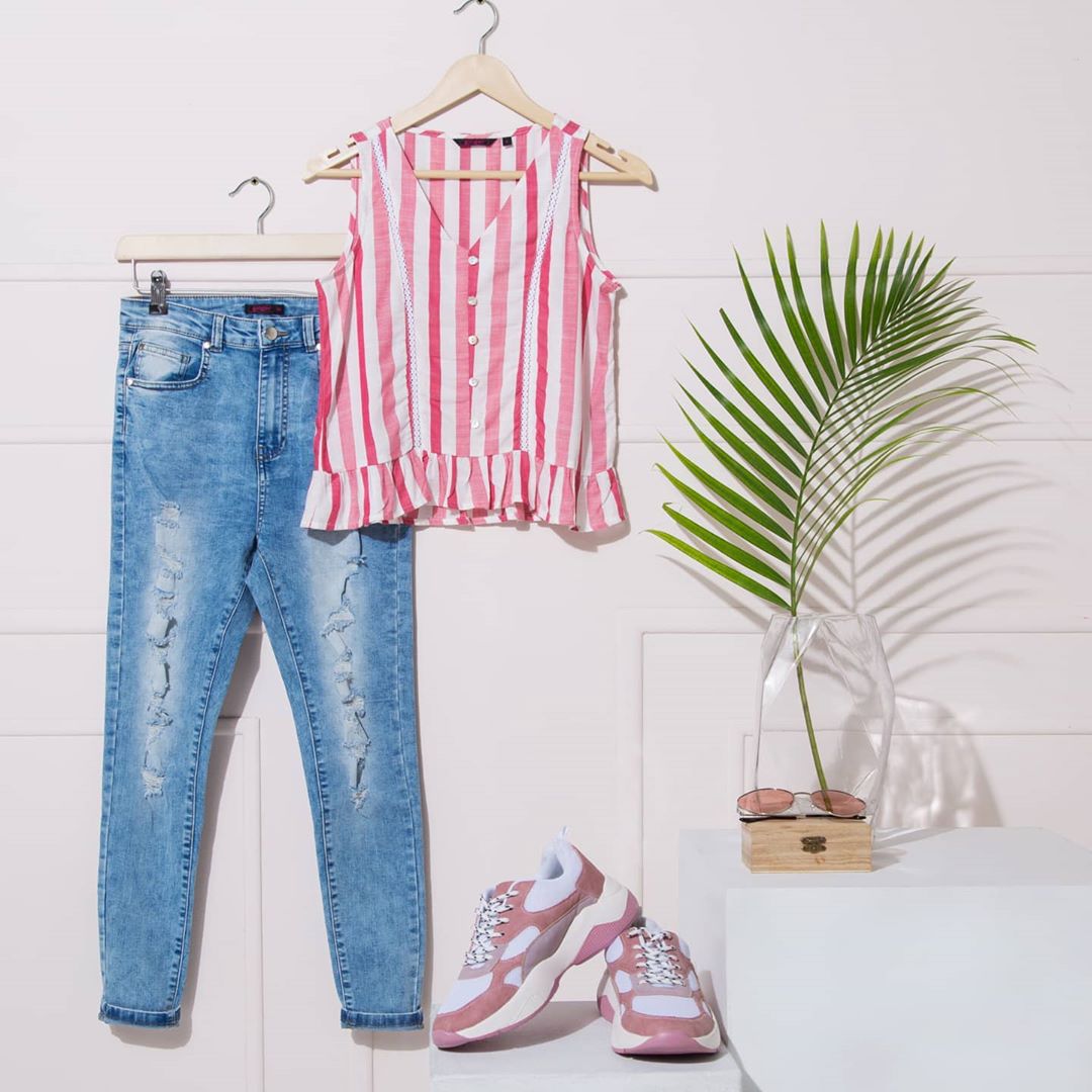 Lifestyle Stores - Amp up your look for the day in this trending pair of distressed skinny jeans and a cute V-neck top, from Ginger by Lifestyle! Find more amazing denim styles at Lifestyle Denim Dest...