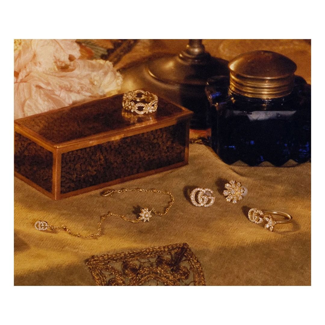 Gucci Official - On a vintage dressing table, new #GucciJewelry gold pieces enriched with diamonds feature flowers combined with the Double G—an archival code from the 70s. Discover more through link...