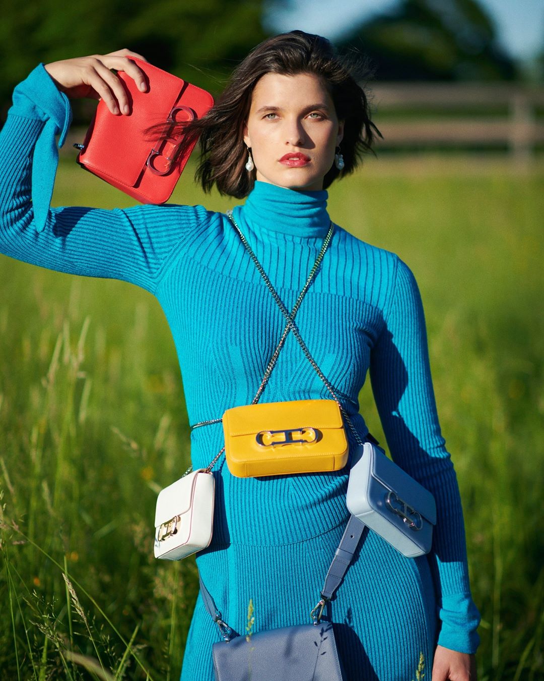 CAROLINA HERRERA - Because you can never have too many #CHInsignia bags. Zircon blue ribbed turtleneck and skirt from our Fall 2020 collection. Shot by @paul_maffi at @wesgordon’s farm in Connecticut....