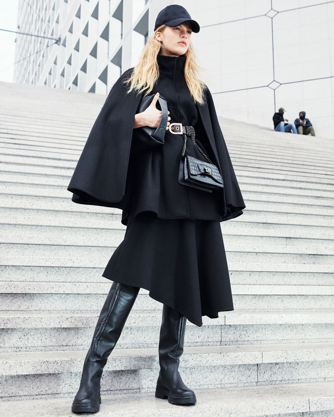 Max Mara - Back to black. Create a sleek silhouette with the new versions of the #MaxMaraFW20 total black shoulder bag and clutch, paired with knee-high leather boots and #MaxMara #FW20 ready-to-wear.