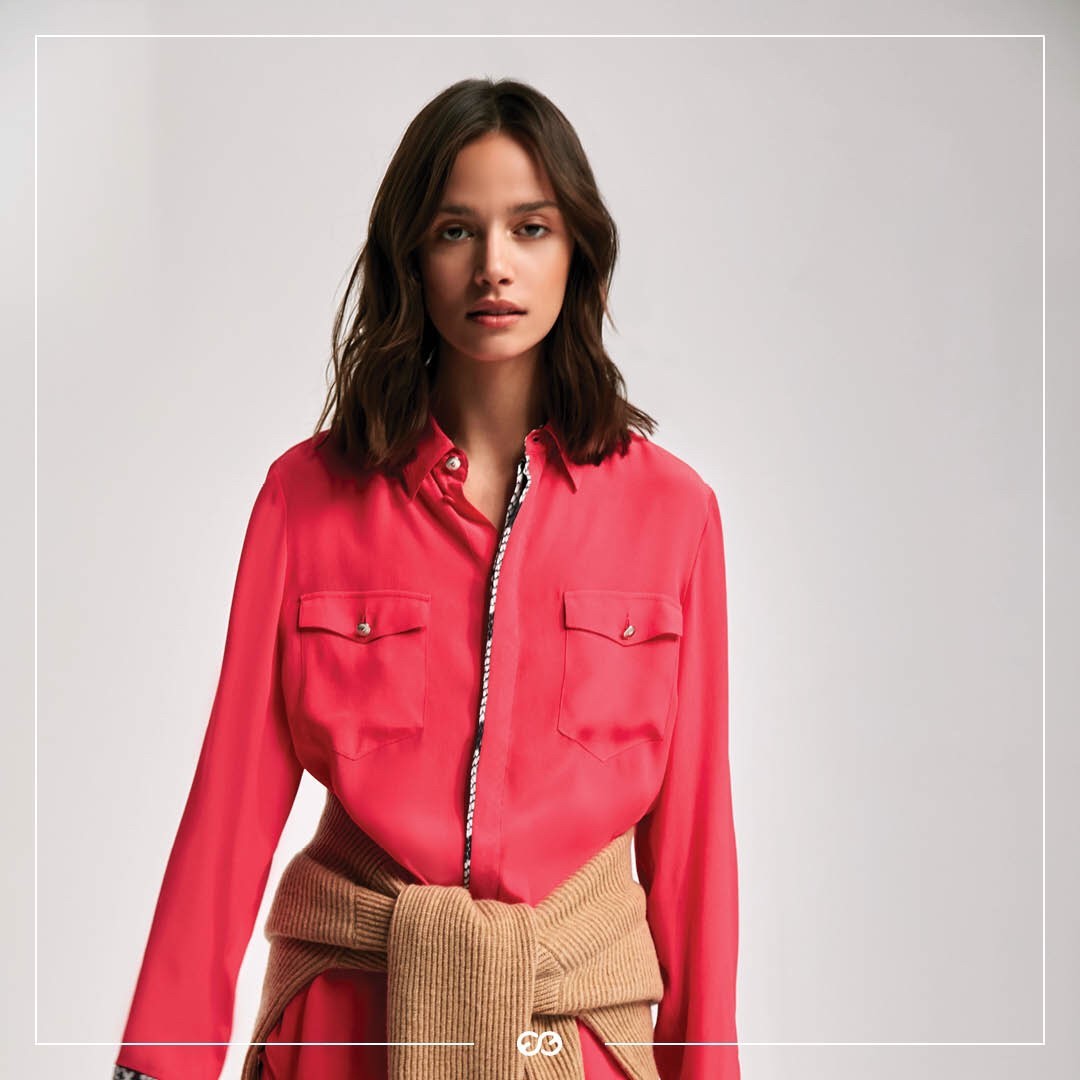 ESCADA - This classic silk shirt gets a fresh update for Fall, thanks to a bold coral hue that pairs perfectly with rich autumnal tones and chunky camel coloured knits. Available online and in stores...