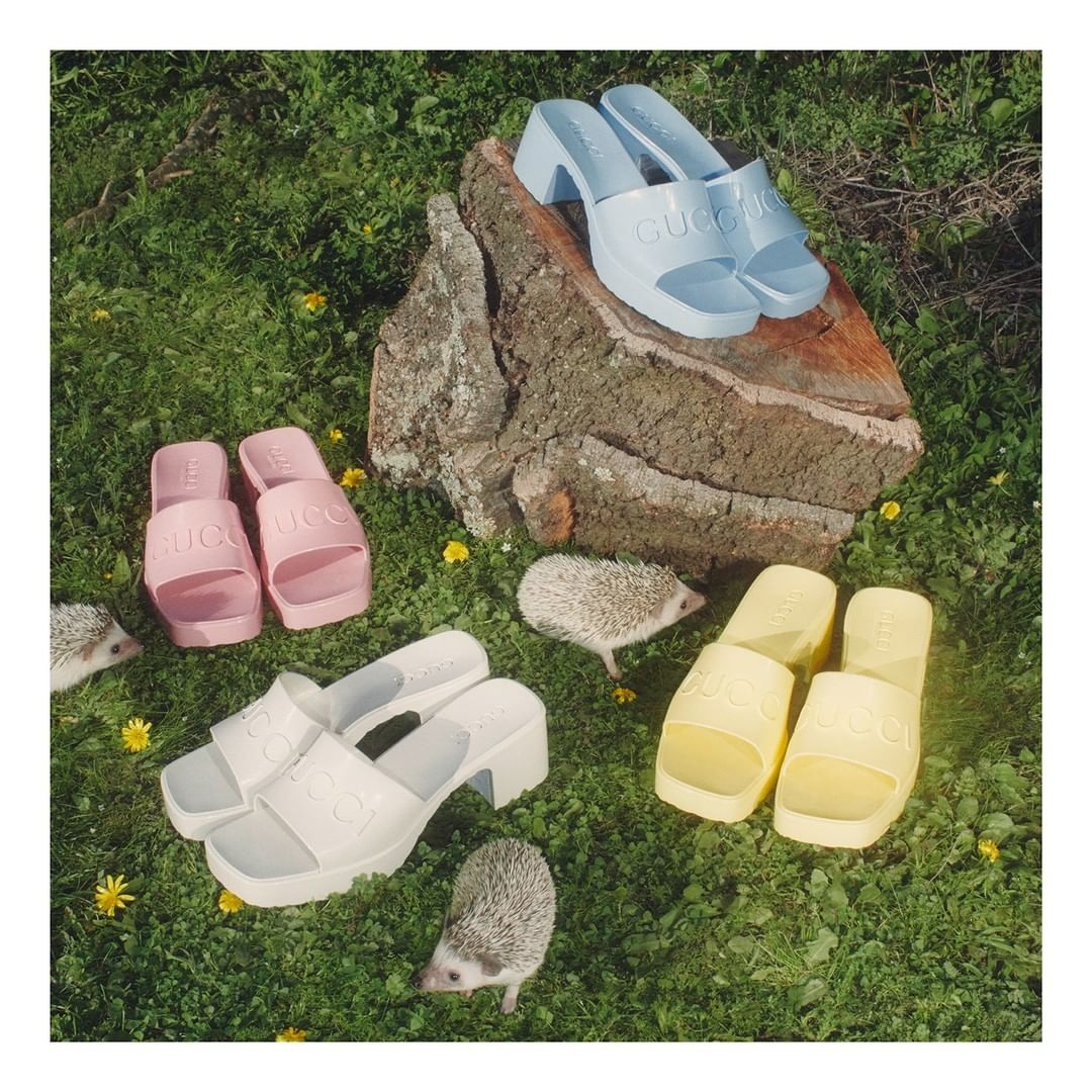 Gucci Official - Slide sandals in delicate shades feature a chunky heel and embossed logo recalling 90s styles with a retro appeal. The shoes are part of #TowardsTheSun, a collection of warm weather d...