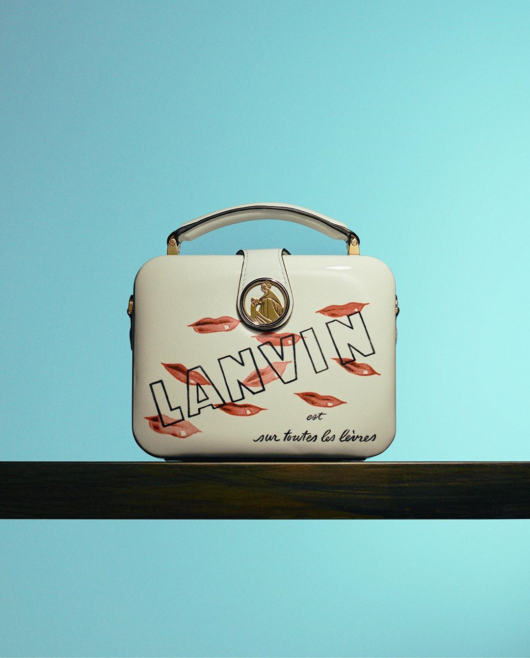 LANVIN - “Lanvin est sur toutes les lèvres“ (“Lanvin is on everyone’s lips“): the “lipstick“ print on the Bento minaudière comes from an original #LANVIN beauty commercial from 1938. 
The “Cosmetics...