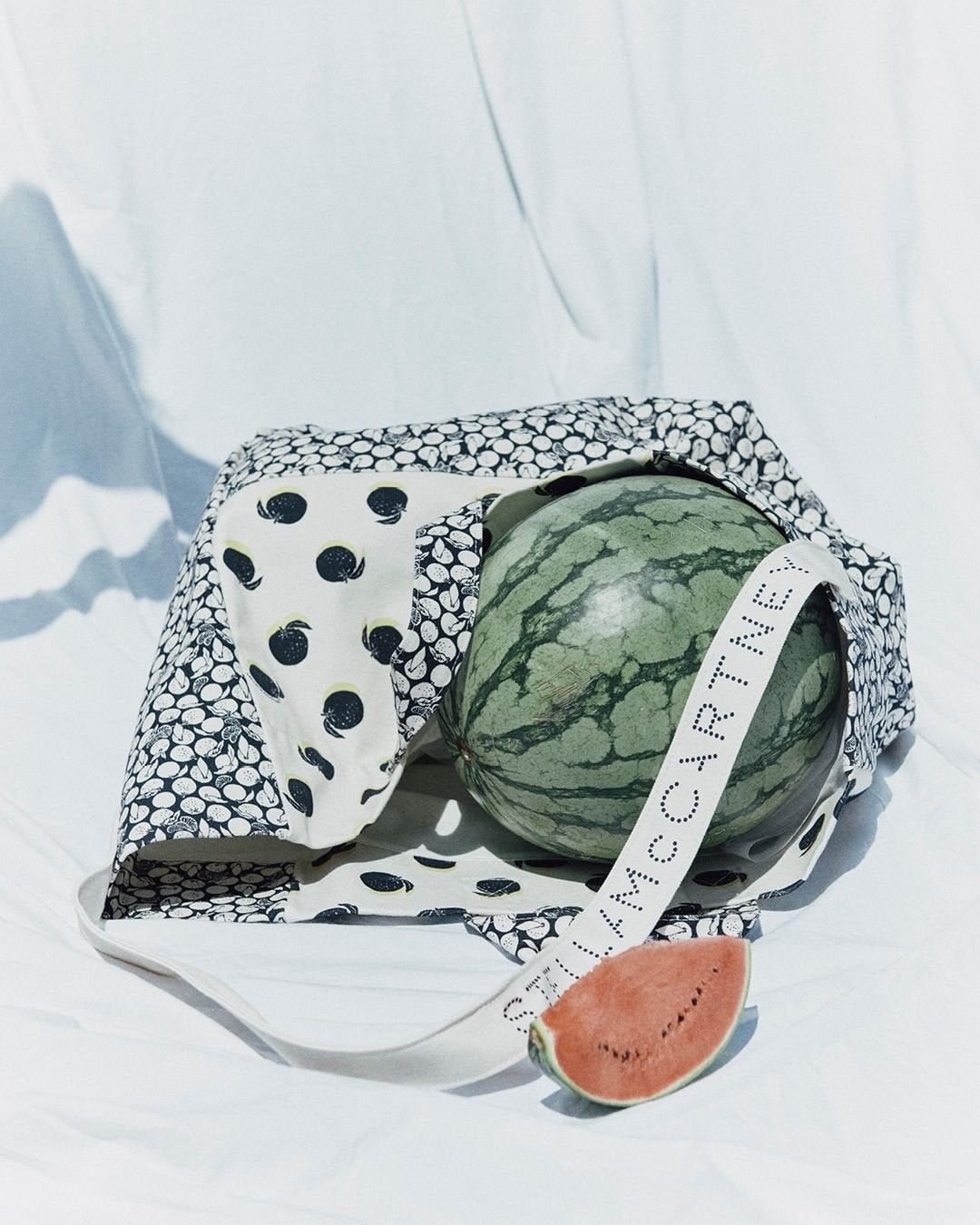 Stella McCartney - “Eating watermelon as your hair is dripping from the last sea swim, the mesmerising music of the waves.” – Melanie + Ramon⁣
⁣
Our new season swim accessories dive into the dreamy fa...