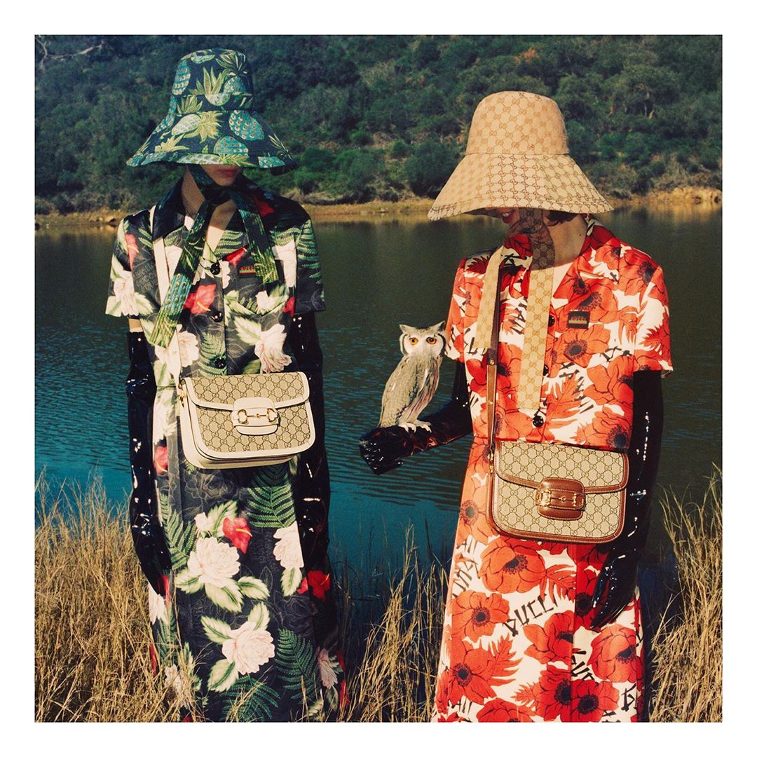 Gucci - Contemporary two-piece sets of cropped silk jackets and skirts in colorful prints featuring Hawaiian inspired flowers or red poppies worn with #GucciHorsebit1955 shoulder bags. Shop the #Gucci...