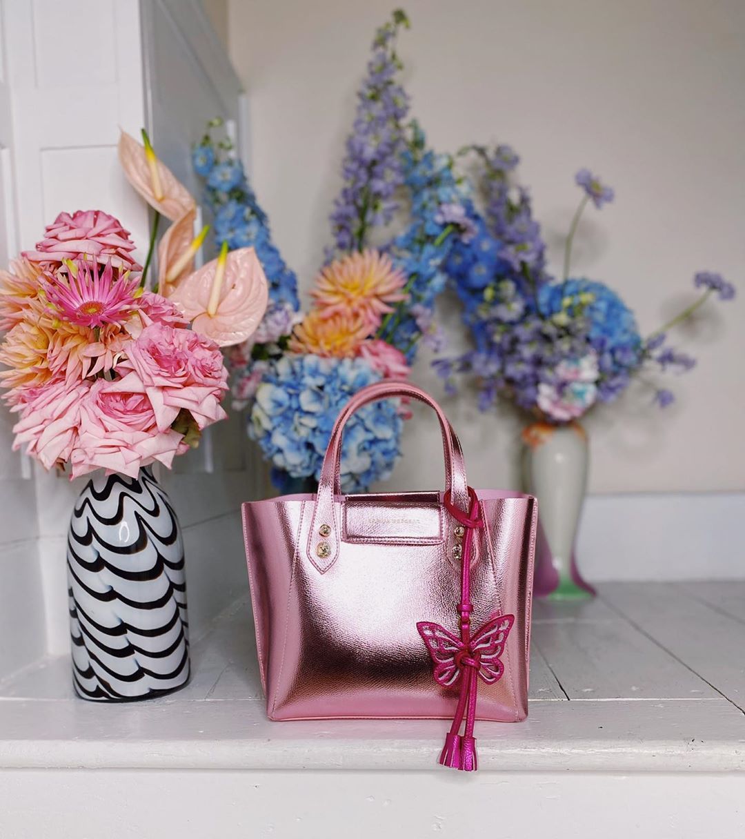 SOPHIA WEBSTER - Have you said hola to our 'Hola'? 🦋👜⁣⁣⁣
⁣⁣
Our 'Hola' tote bag has been crafted out of soft nappa - with gem details and a removable butterfly charm. You will not want to let go of ou...