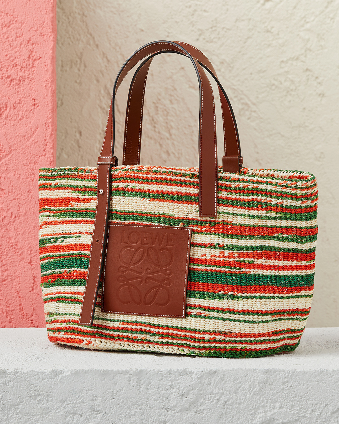 LOEWE - A new take on the traditional market bag arrives from the Paula's Ibiza 2020 collection. Handwoven in multi-coloured sisal through collaborating with communities of artisans. 

Available in LO...
