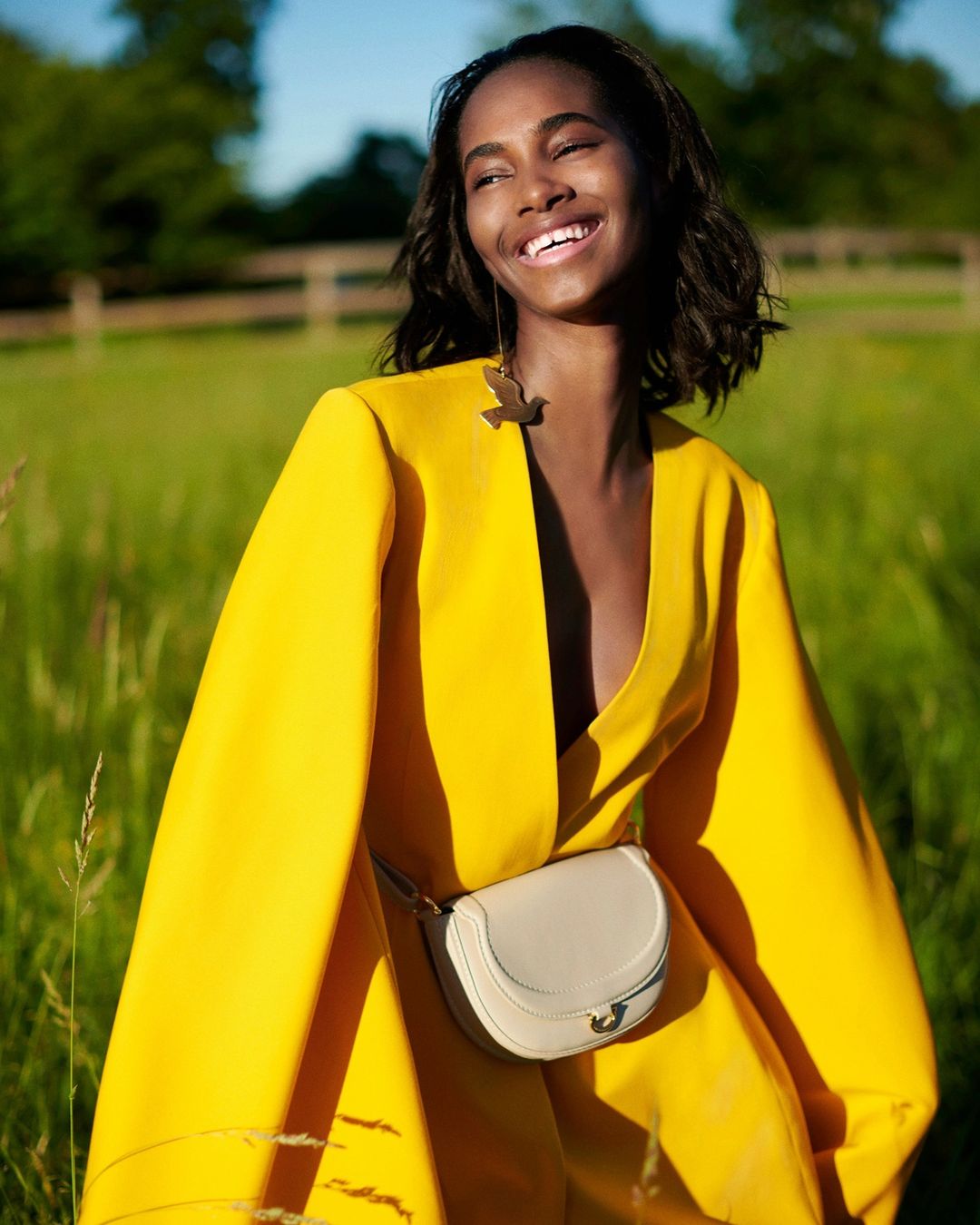 CAROLINA HERRERA - Happy days! A striking yellow coat from our Fall 2020 collection and a #CHCharroInsignia bag in beige. Shot by @paul_maffi at the country home of Creative Director @wesgordon in Con...