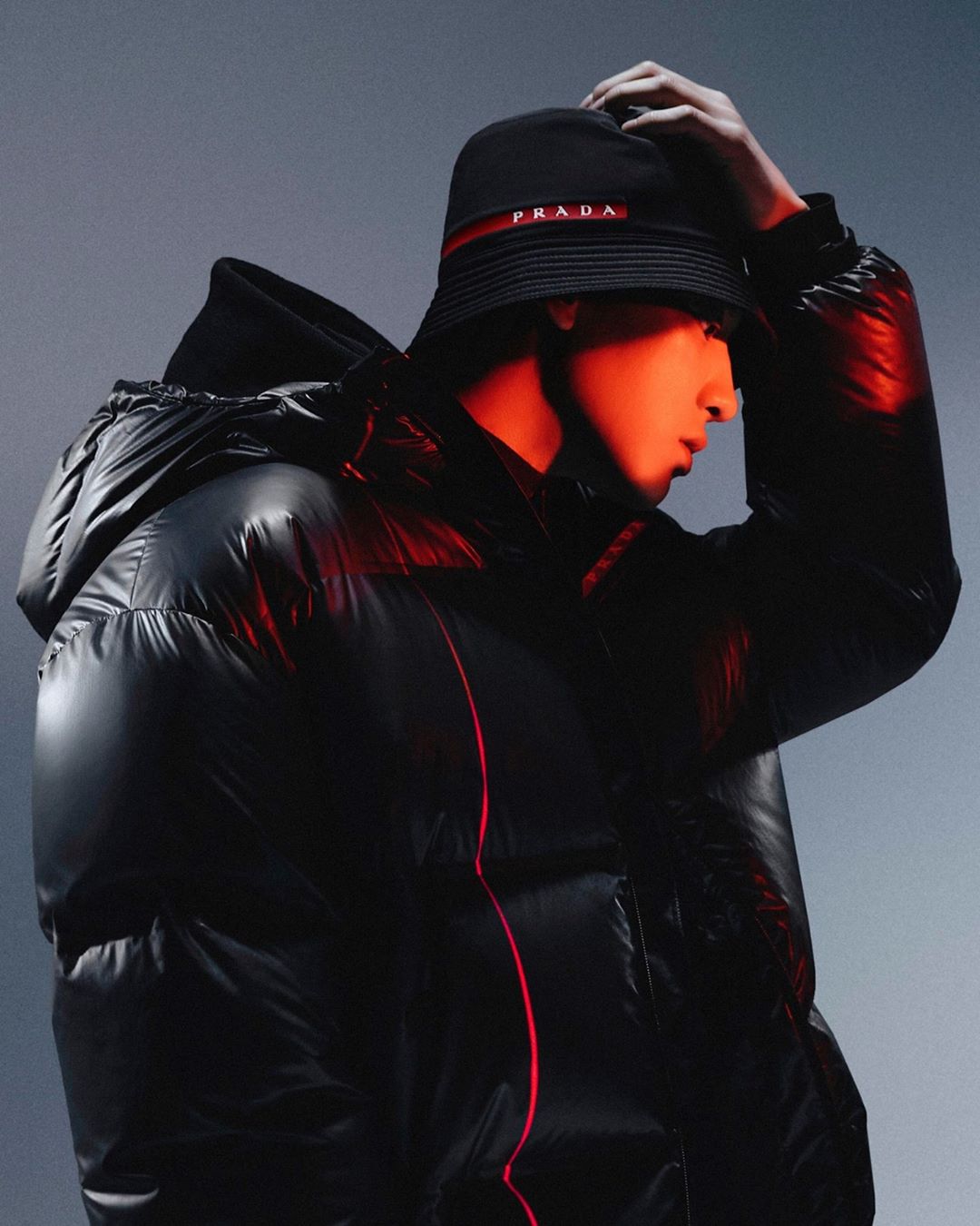 Prada - Weatherproof. @real__pcy wears a #PradaLineaRossa FW20 Nylon Accoppiato Light puffer and Tela Tecnica bucket hat. 
#chanyeol photographed by @mokjungwook
Creative direction @ferdinandoverderi...