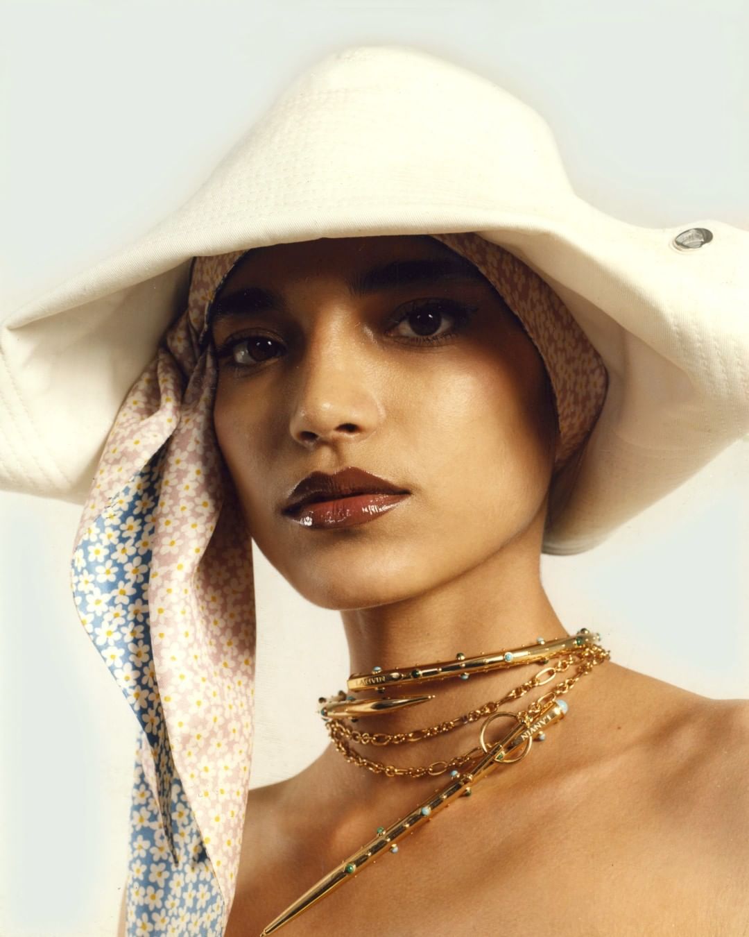LANVIN - #LanvinSS20 Bicorn gazar hat, daisies silk scarf and bejeweled Pencil choker and necklace. More via link in bio and in stores.
#LanvinJewelry
#Lanvin