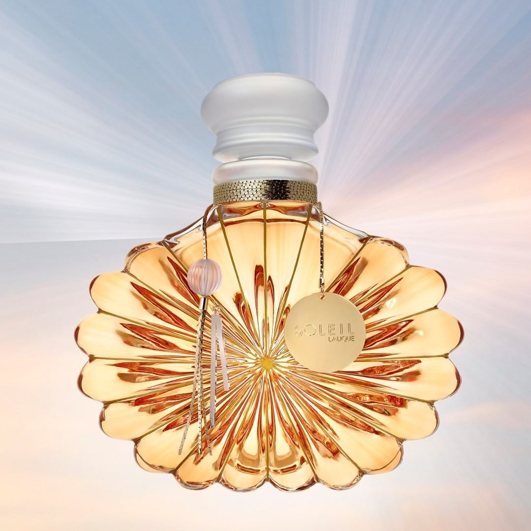 LALIQUE - We are excited to offer Soleil Lalique in an ultra exclusive Limited Edition of twenty signed and numbered 1500ml crystal flacons adorned with rays of gold. A spectacular masterpiece of crys...