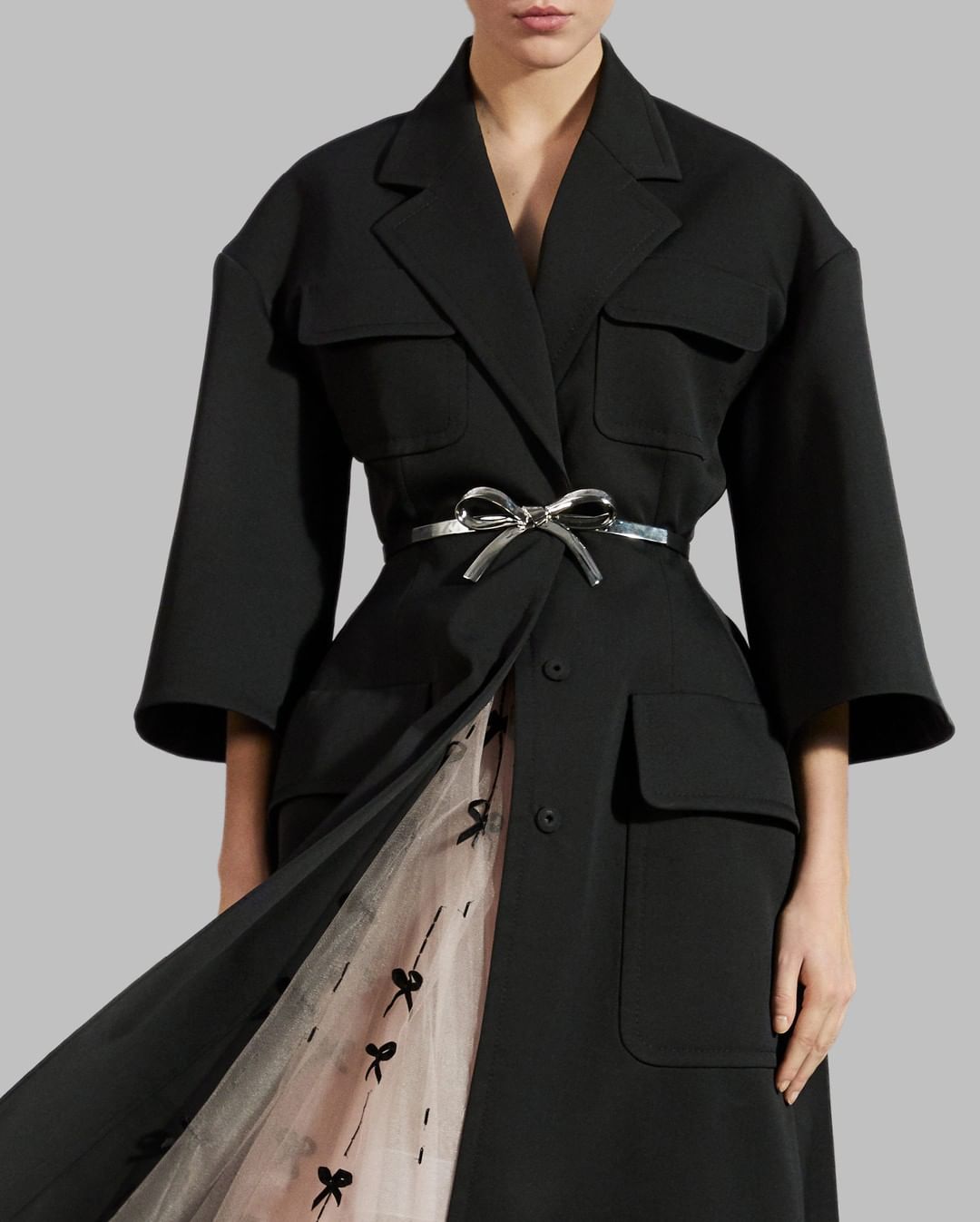 CAROLINA HERRERA - Peek-a-bow! Create a dramatic silhouette with this beautifully tailored Italian virgin wool coat and sheer tulle gown, hand-embroidered with velvet bows and glass lochrosen stones....