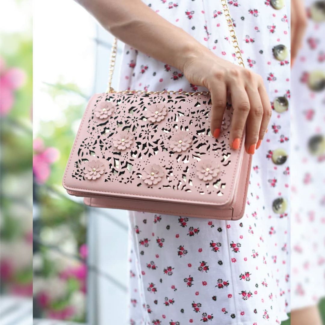 Lifestyle Stores - The perfect accessory to the perfect dress... add a touch of floral chic to your look with this gorgeous laser-cut sling bag with floral applique from Ginger by Lifestyle!
.
Tap on...