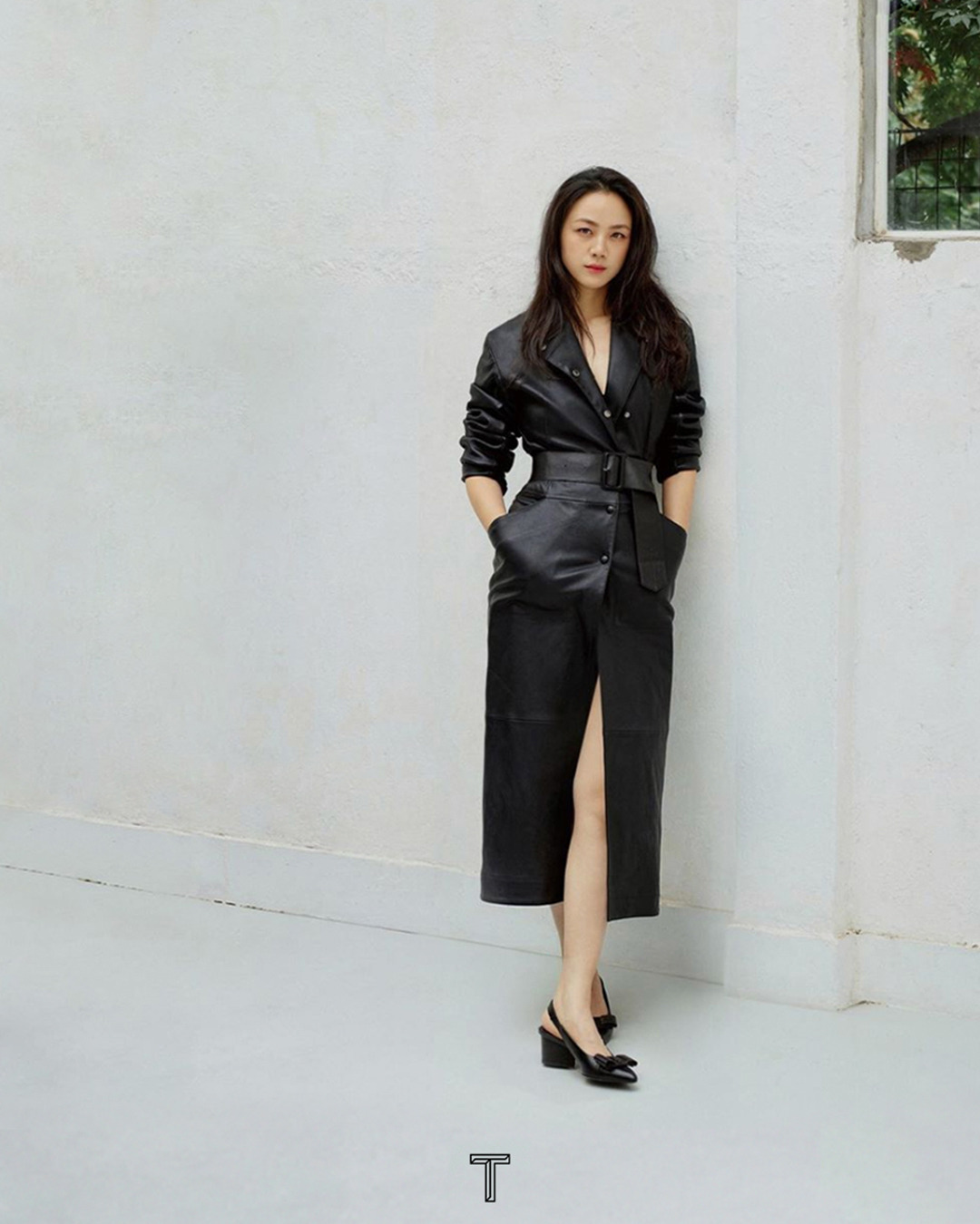 Salvatore Ferragamo - Effortless Chic: featured in the pages of @tmagazinechina , a sleek and sophisticated belted leather coat paired with black slingback Viva pumps. Swipe for a modern take on relax...