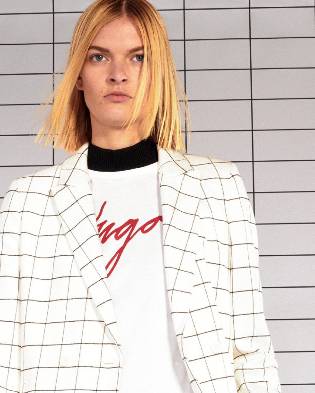 HUGO - Winning the tailoring game: a summer suit from HUGO Womenswear, patterned with a check inspired by the tiles of the Berlin U-bahn #PreFall20 #iamHUGO