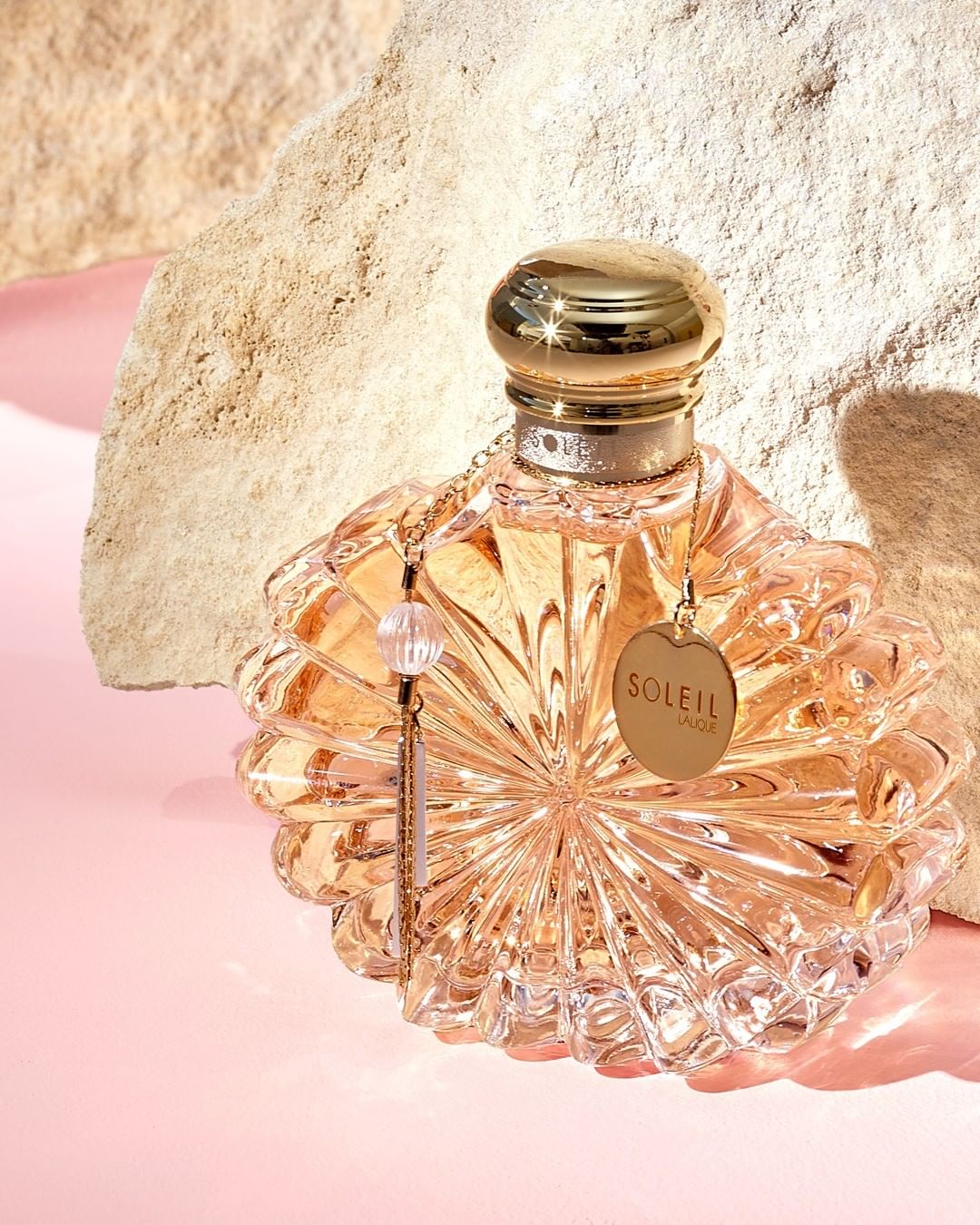 LALIQUE - The dazzling light of fruit & spices, the addictive treat of a gourmand heart and the silky caress of flowers and musks. Golden and warm as the rays of the sun, discover Soleil Lalique Eau d...