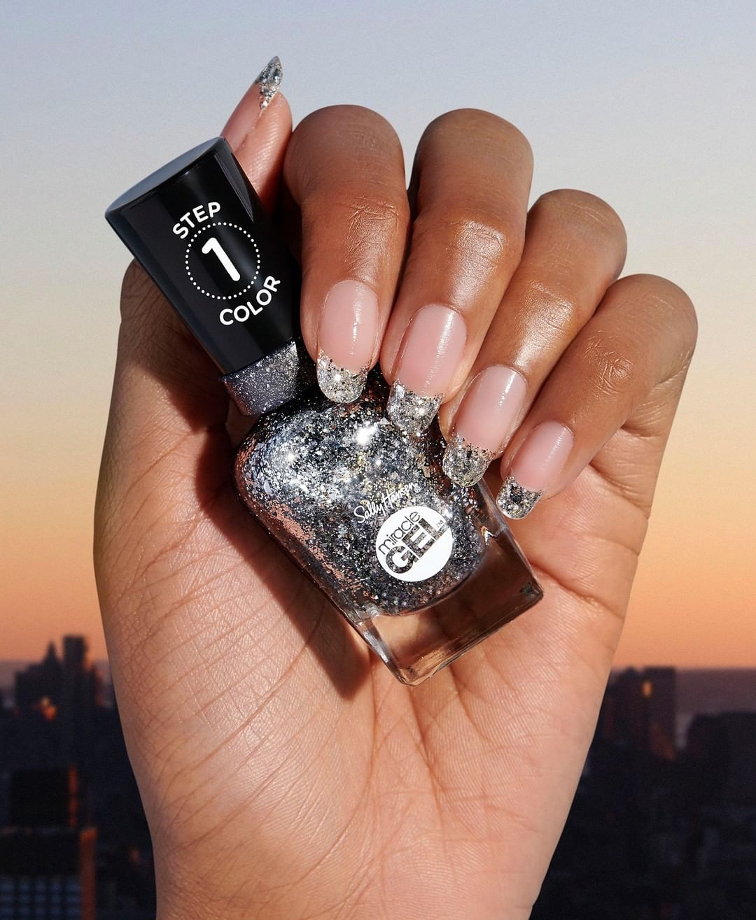 Sally Hansen - A shine that rivals the sun ☀️. Pair a sparkly stunner like Deep Sea Diamond with our new and improved Shiny Top Coat for a shade that stays for days ✨